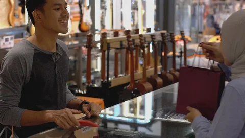 Asian Muslim Man Using Smartwatch Payment Stock Footage 127613552