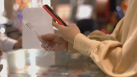 Asian Muslim Woman Using Mobile Phone To Scan QR Code Stock Footage