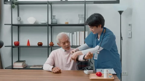 Asian nurse checking elderly man blood pressure and heart rate with digital.. Stock Footage 226318723