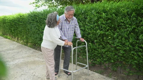 Asian old couple walk with walker at  home. senior man using a walker  workin Stock Footage 139097953