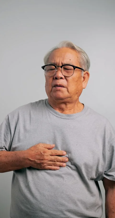 Asian old man has difficulty breathing. An elderly man has dyspnea. Stock Footage 261041271