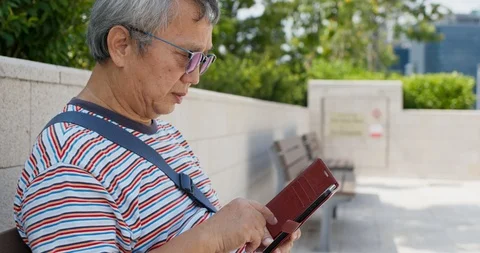 Asian old man use of smart phone at outdoor Stock Footage 115890322