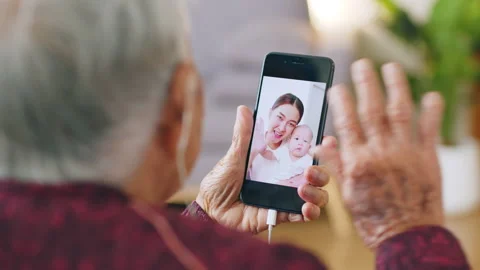Asian old senior making video call via mobile phone talking with family Stock Footage 189201528