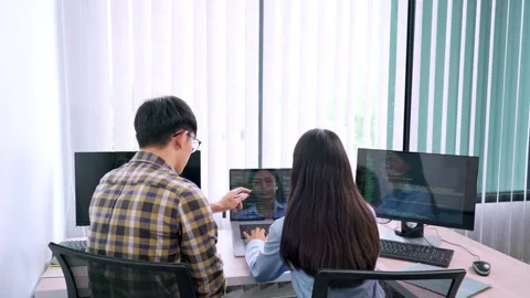 Asian Outsource Software engineer Developer Team Working Code to find solution Video stock 144189792