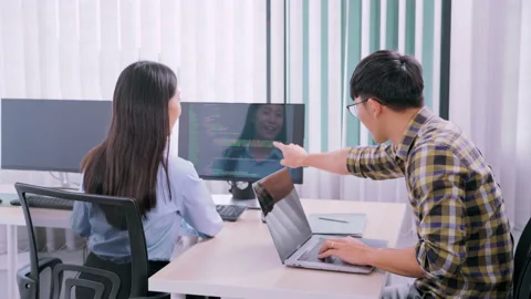 Asian Outsource Software engineer Developer Team Working Code to find solution Video stock 144190363