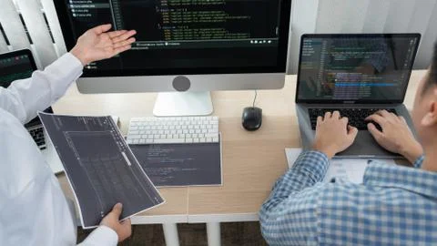 Asian Outsource Software engineer Developer Team Working Code to find solutio Stockfoto's