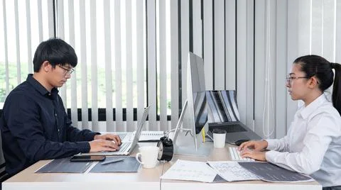 Asian Outsource Software engineer Developer Team Working Code to find solutio Stock Photos