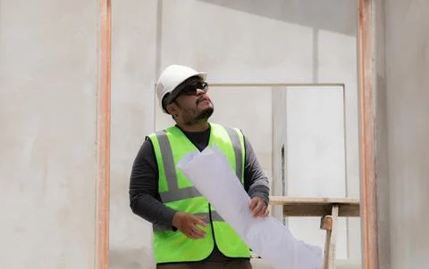 Asian overweight construction project foreman inspects construction site ho.. Stock Photos