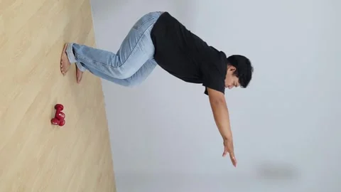 Asian Overweight man doing squats at home, legs strength workout program, joint Stock-Footage 342227386