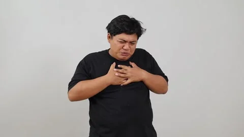 Asian overweight man having chest pains, suffering from heart pressure indoors Stock Footage 342227363