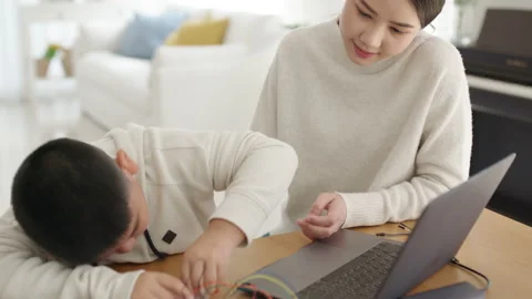 Asian parent teach kid learn coding toy stem car at home. Video stock 152605519