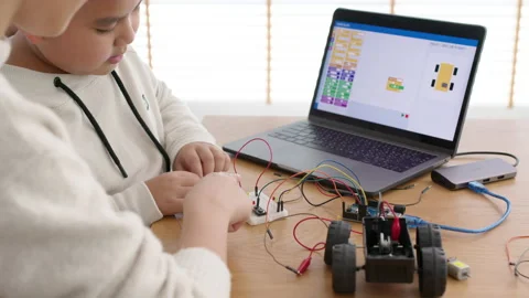 Asian parent teach kid learn coding toy stem car at home. Stock Footage 152606323