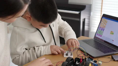 Asian parent teach kid learn coding toy stem car at home. Video stock 152606328
