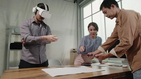 Asian people Architects teamwork using tablet and Virtual Reality headset wor Stock Footage 198690432