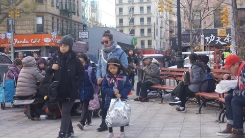 Asian People Sitting At Table In Square In China Town - Pan - Right To Left Stock Footage 86877684