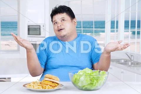 Asian person thinking to choose food Stock Photos