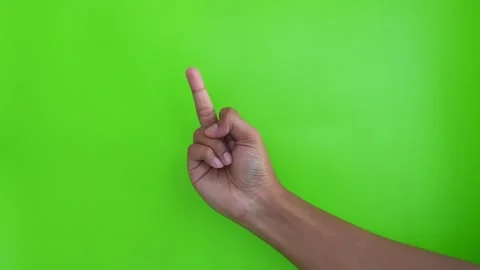 Asian person's hand is giving a middle finger gesture on a green background. Stock Footage 332152125