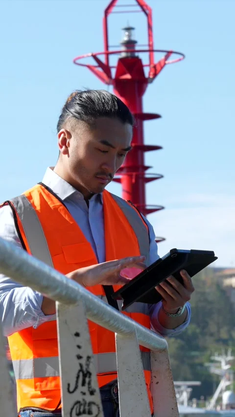 Asian port engineer inspecting cargo with tablet Stock Footage 333731475
