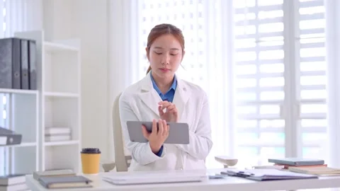 Asian professional doctor scientist using digital tablet computer research .. Stock Footage 335626233