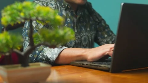 Asian Professional Typing Close Up on Laptop Keyboard at Wooden Desk Stock Footage 332081535