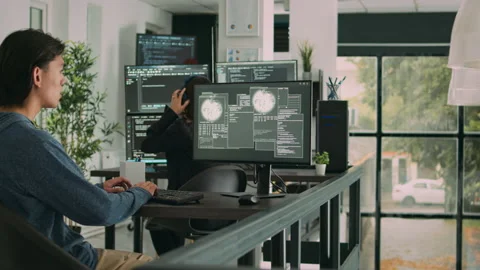 Asian programer focused on writing code encounters unexpected compiling error Stock Footage 219900774