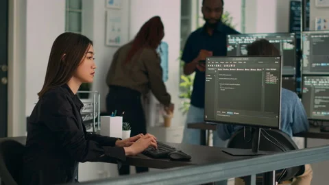 Asian programer typing big data code on computer to work on app developing Stock Footage 227615645