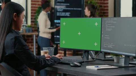 Asian programer writing code in front of computer with green screen chroma key Stock Footage 168242295