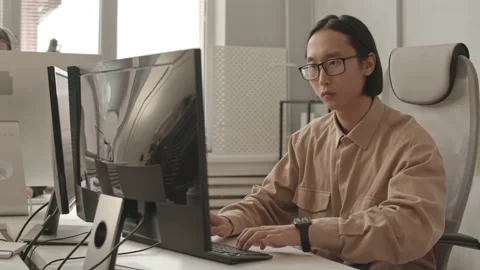 Asian Programmer Working on Computer Stock Footage 165719726