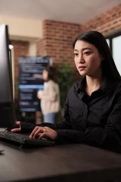 Asian programmer working with html script on terminal window Stock Photos