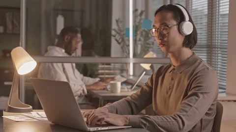 Asian Programmer Working in Office at Night Stock Footage 168743726