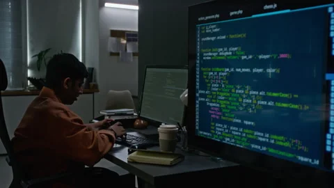 Asian Programmer Writing Software Code on Dual Monitors Stock-Footage 348359666