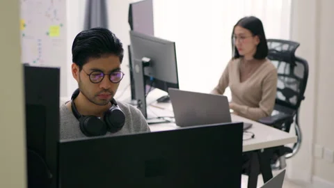 Asian Programmers Collaborating on Software Development in Modern Office. Stock Footage 300246214
