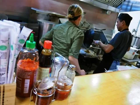 Asian Restaurant Kitchen Cook Preparing Take Out Food Stock Photos