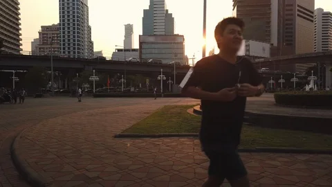 Asian runner city run during sunset Video stock 102939397
