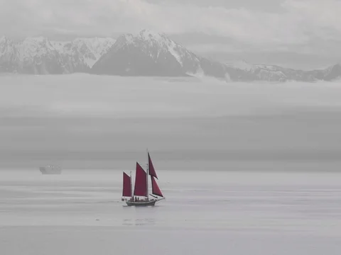 Asian Sailboat Red Sails Ocean Mountains Behind Stock Footage