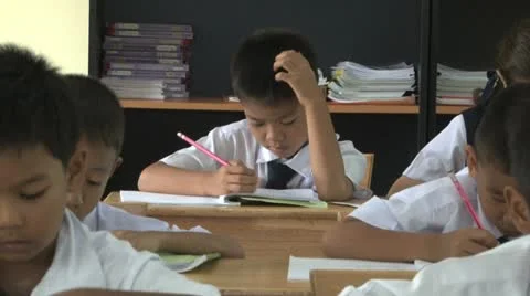 Asian School Boys Doing Work In Their Classroom 스톡 동영상 12439067
