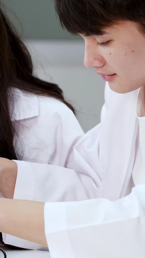 Asian Science Students Using Hot Glue Gun for Engineering Project Stock Footage 347121663