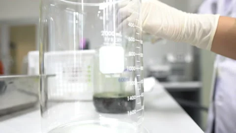 Asian scientist cut sample for experiment Stock Footage 160783087
