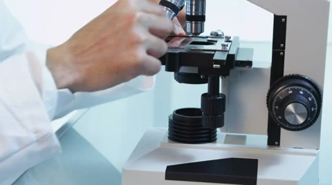 Asian scientist looks into microscope Stock-Footage 62281893