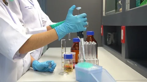 Asian scientist working in the lab Stock Footage 95001001