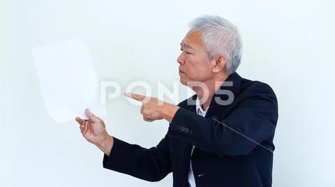 Asian senior businessman unhappy angry expression for report result Stock Photos