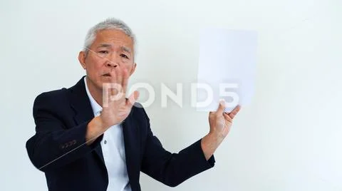 Asian senior businessman unhappy angry expression for report result Stock Photos