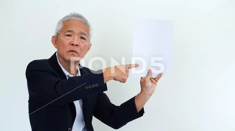 Asian senior businessman unhappy angry expression for report result Stock Photos
