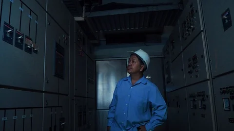 An asian senior computer engineer walking in server data center room Video stock 116751430