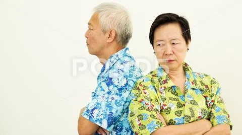 Asian senior couple unhappy, fighting. Relationship problem on white backgrou Stock Photos