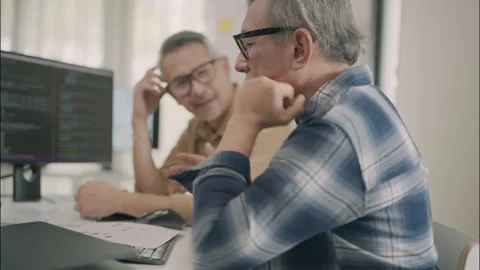 Asian Senior Developers Collaborating On Programming And Software Innovation. Stock Footage 308165271