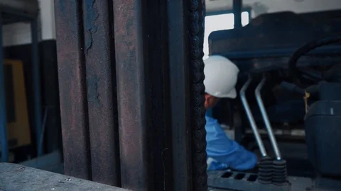 An asian senior engineer checking on a forklift Video stock 116750995