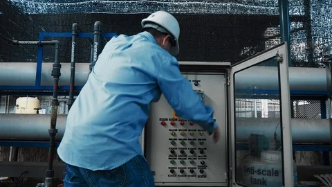 An asian senior engineer or mechanic using water power generator Video stock 116751625