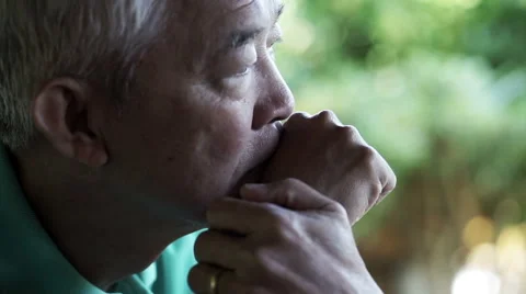 Asian senior guy with hand on face and thinking Stock Footage 62877448