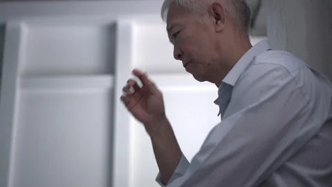 Asian senior man crying while waiting for family emergency accident at hospit Stock-Footage 129701752